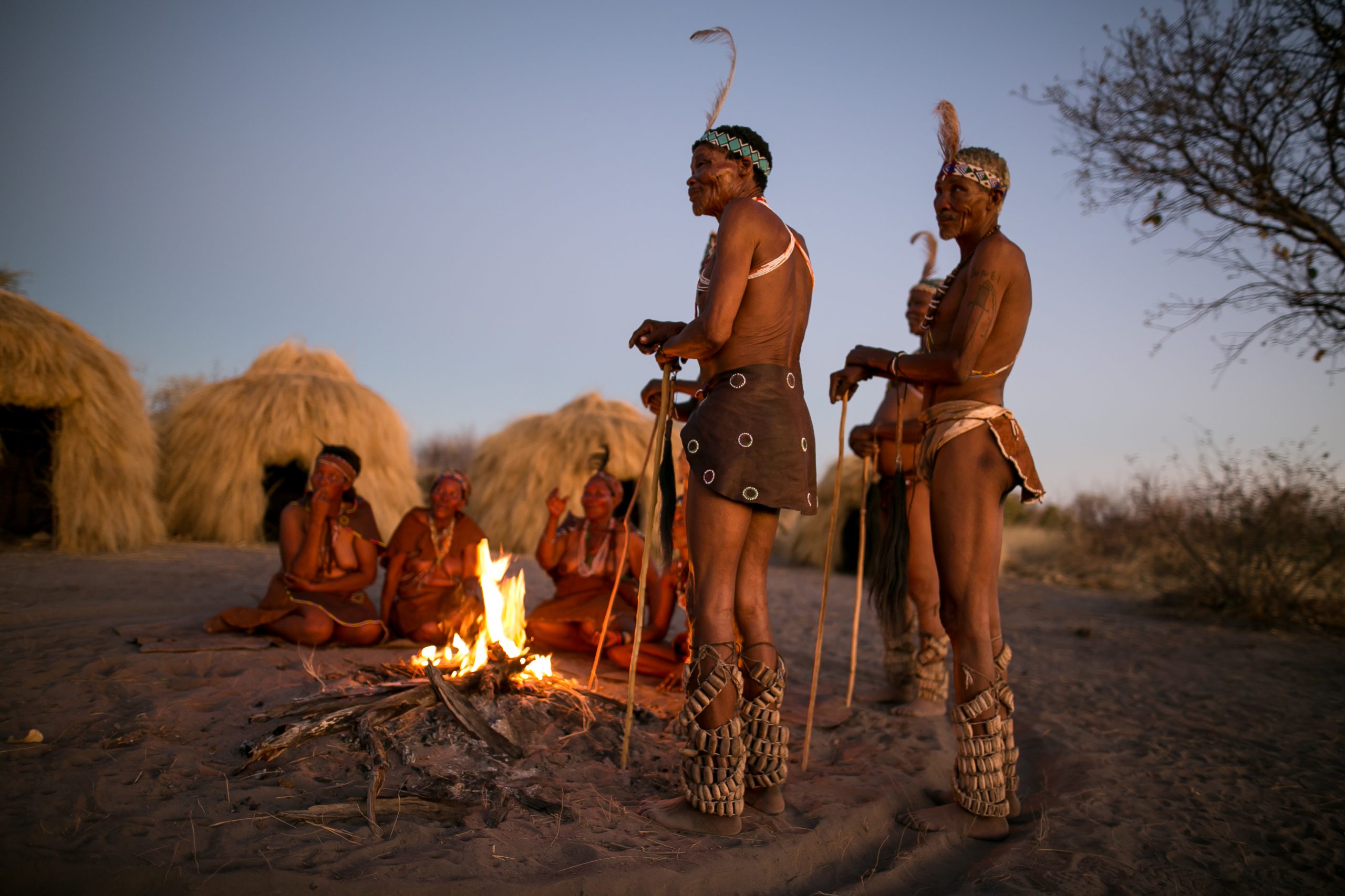Bushman around fire in kalahari