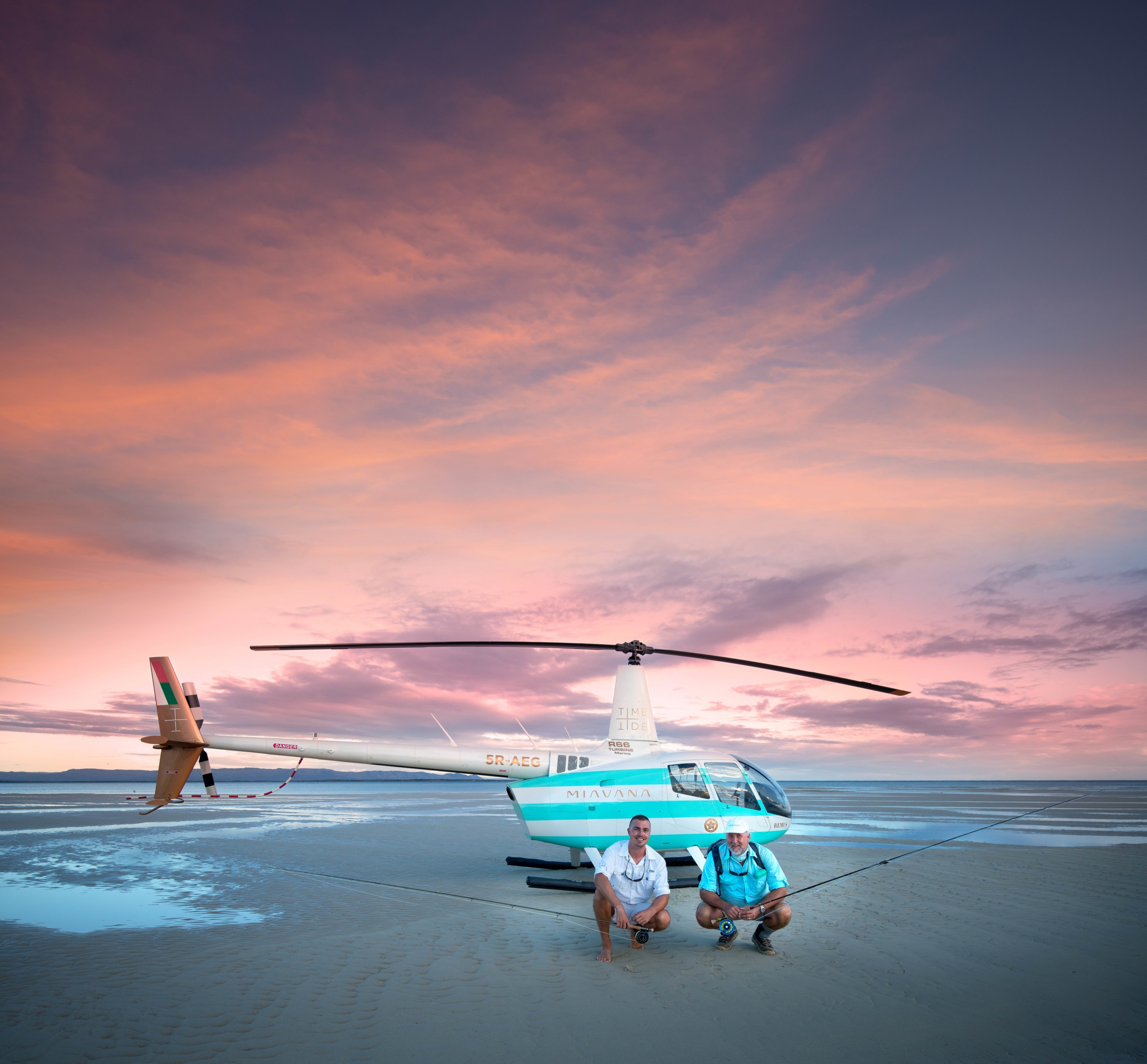 Helicopter and two fisherman on vacation