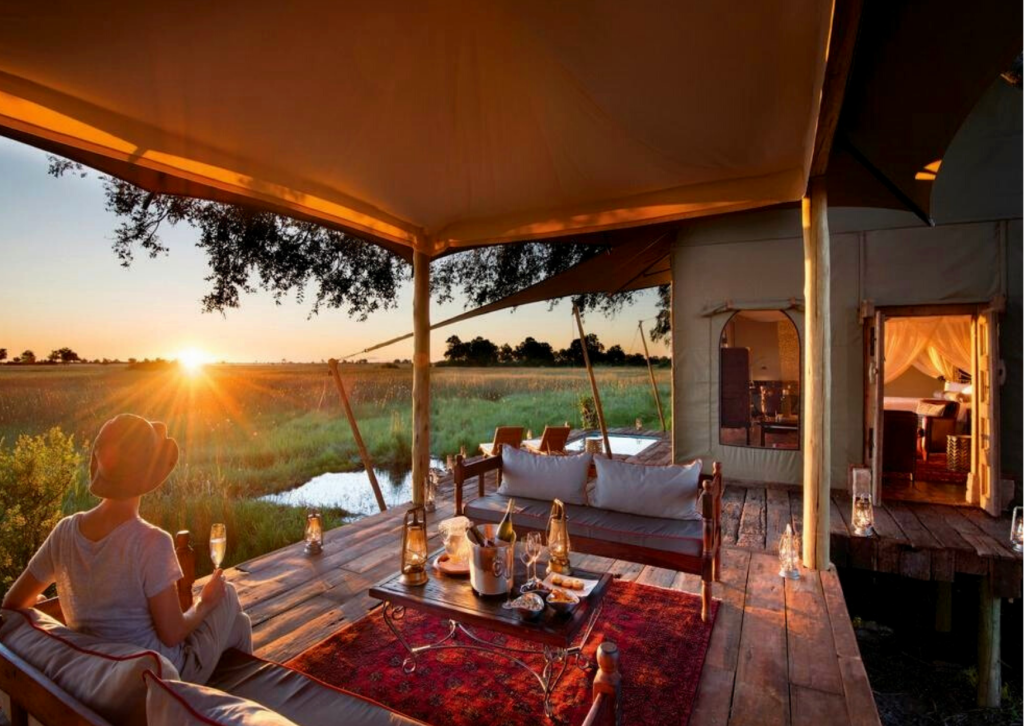 Luxury safari sundowner drink on private veranda