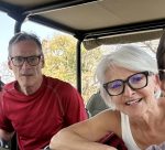 Husband and wife on safari vehicle