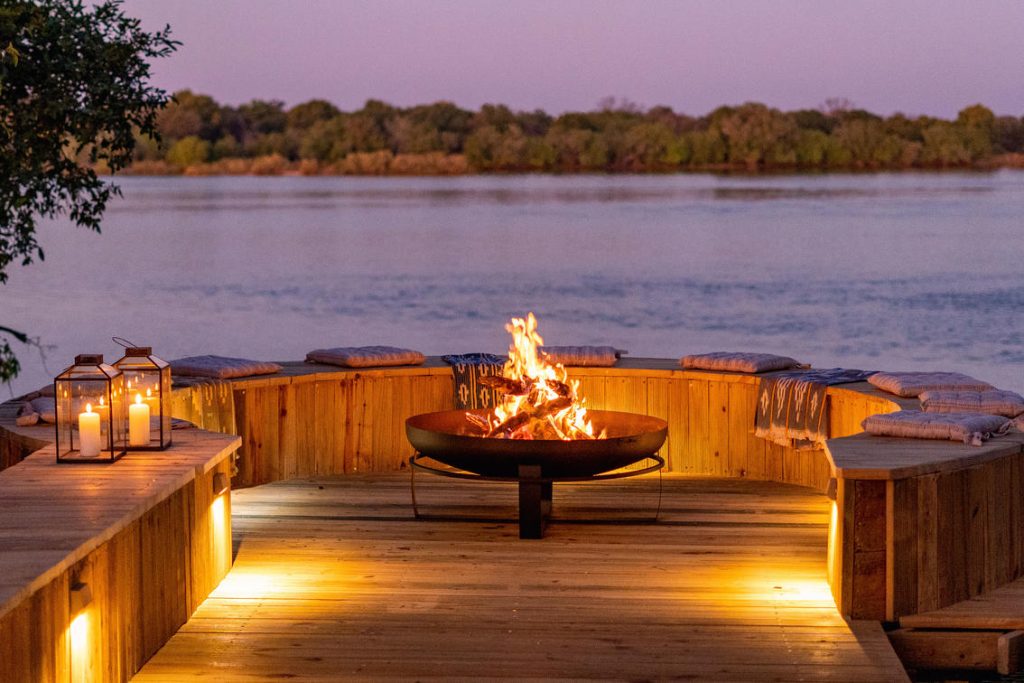 Fire pit with view over Zambezi River at Hippo Creek Villa