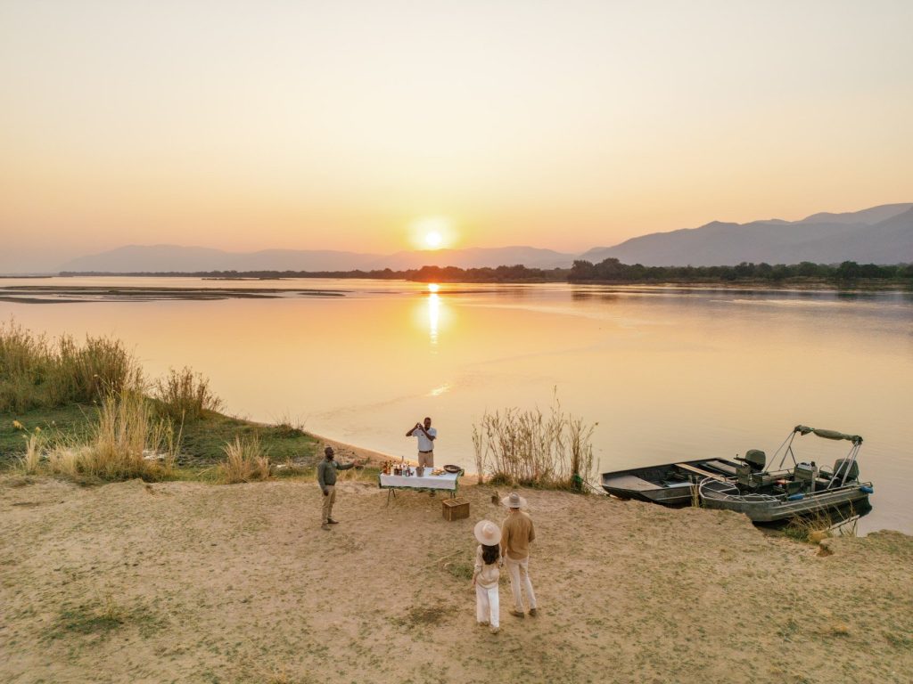 Sundowner drinks om the banks of the Zambezi RIver.